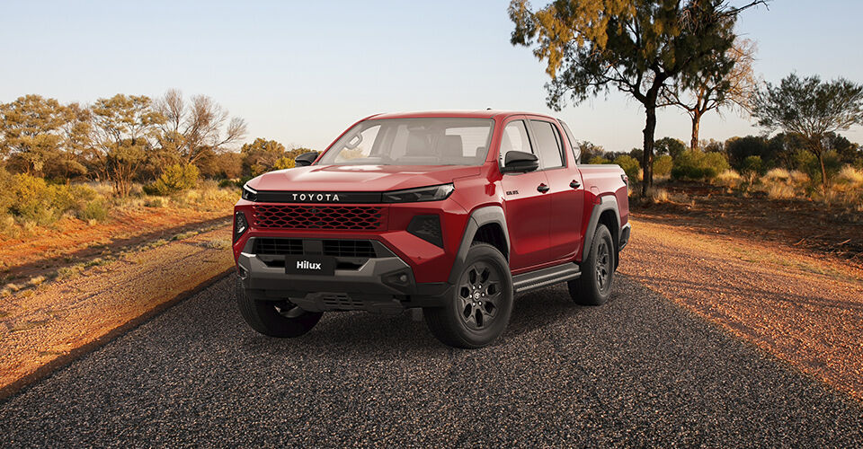 2026 Red Toyota Hilux Ute on outback road