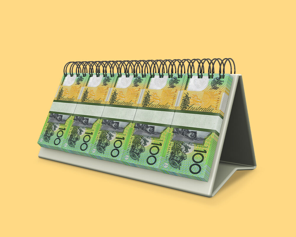 Cash spiral bound onto calendar on yellow background