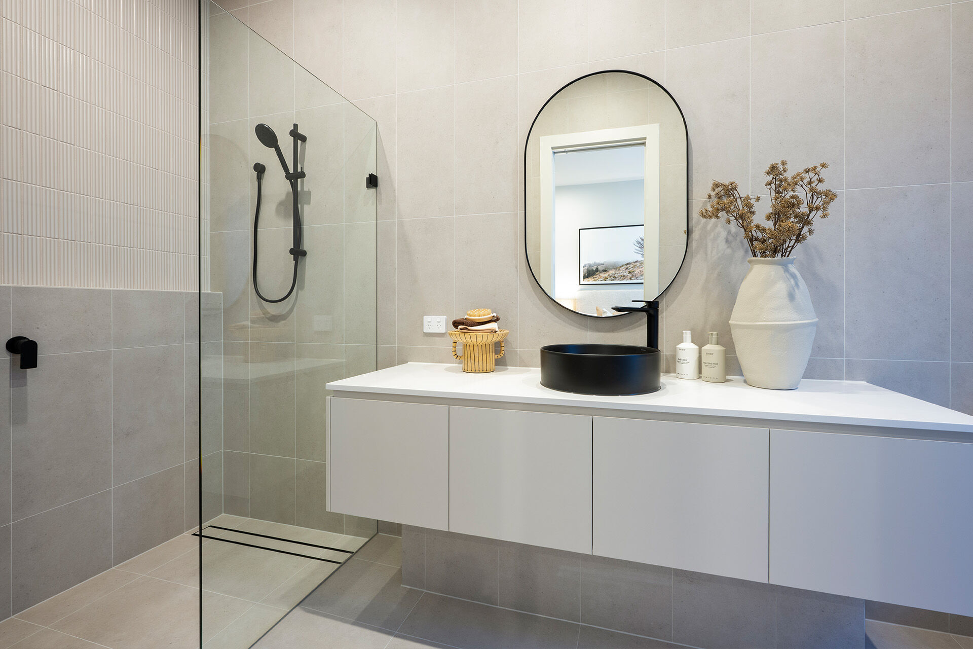 Light bathroon with feature black tapware