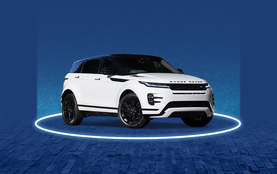White Range Rover luxury car on blue stage with spotlight