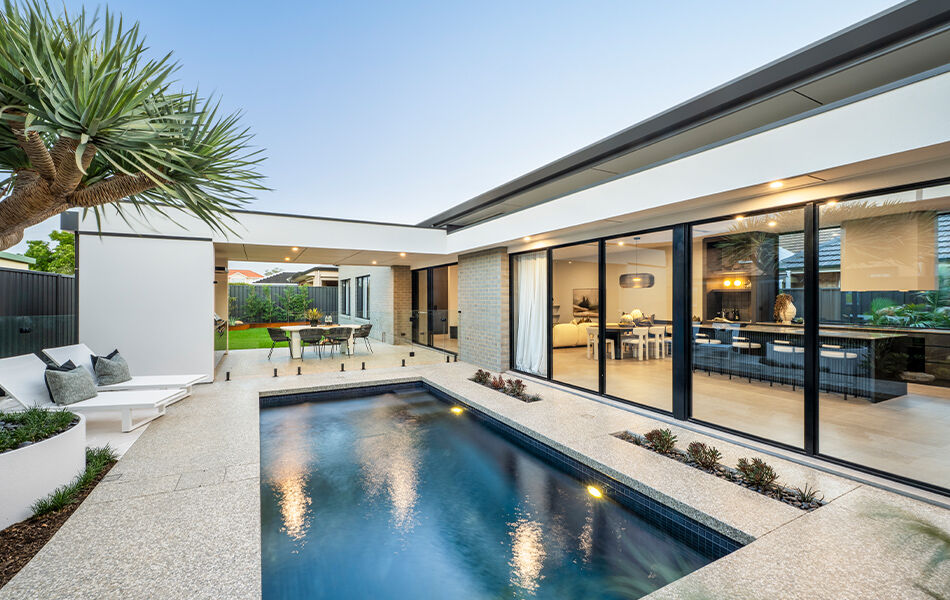 Grand Prize home pool and alfresco looking back at the house into the kitchen