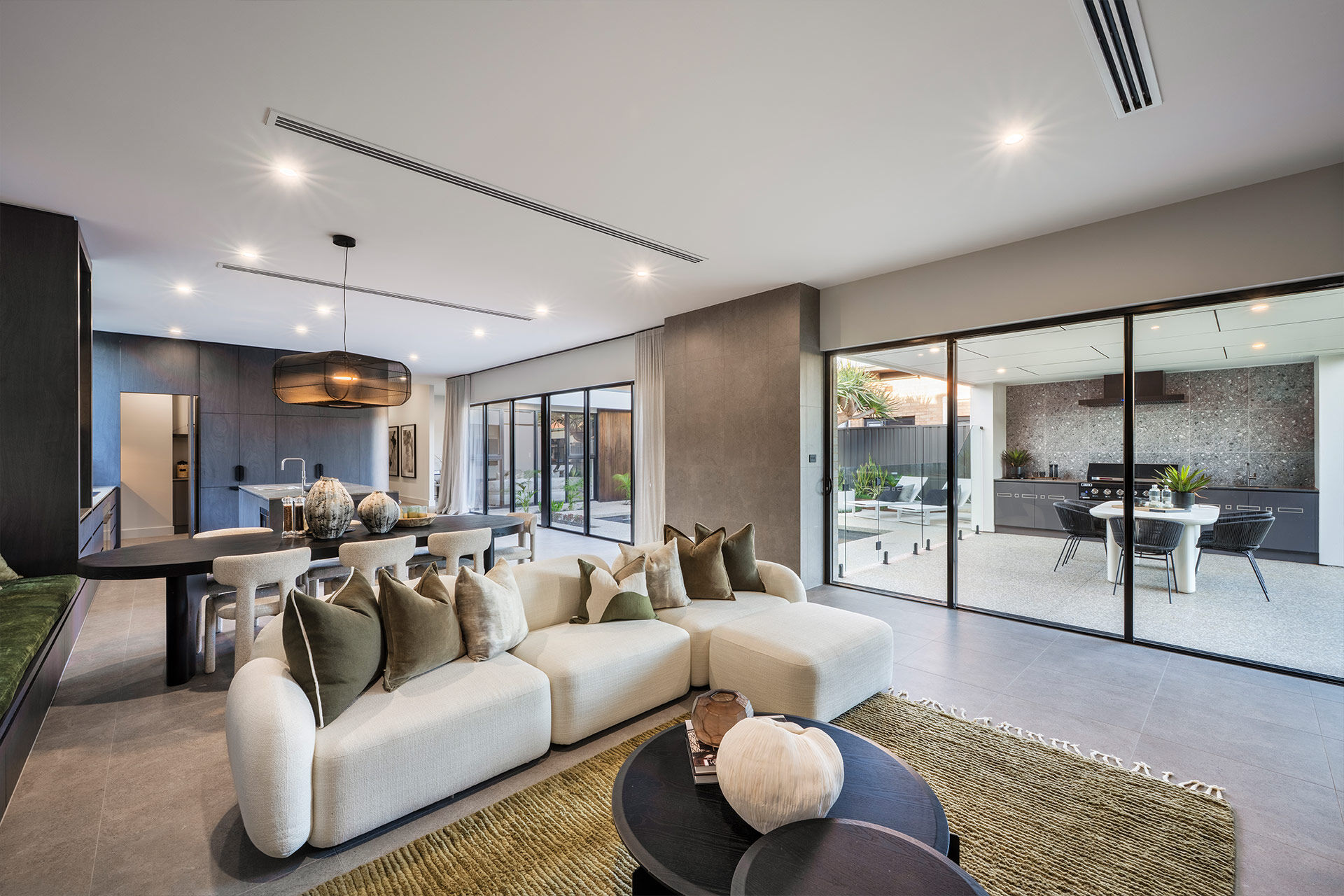 Grand Prize home open plan living with windows to the alfreso dining area