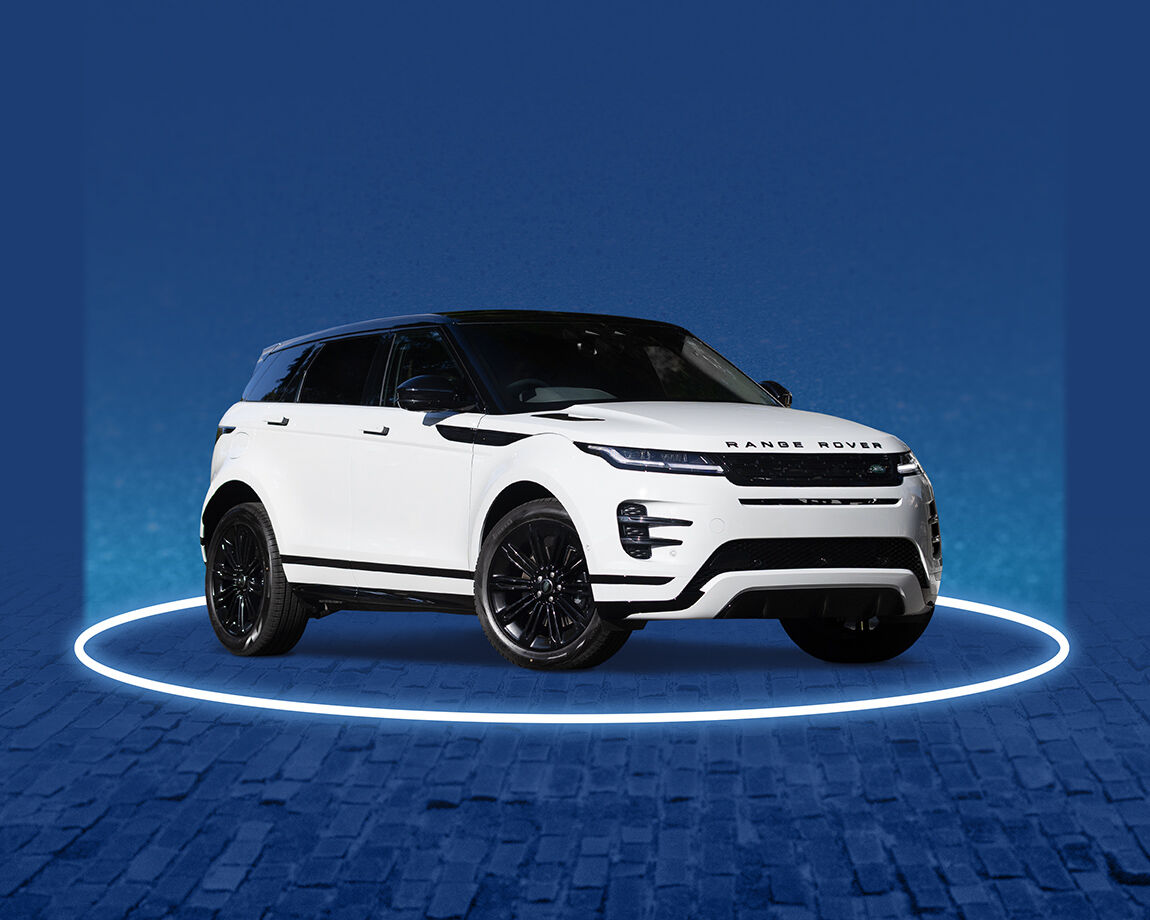 White Range Rover luxury vehicle on blue stage