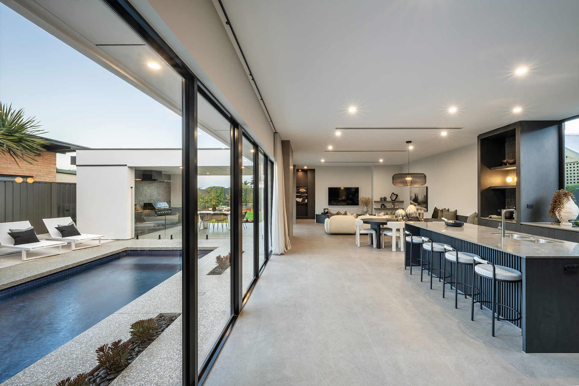 Grand Prize home open plan living with windows to the pool