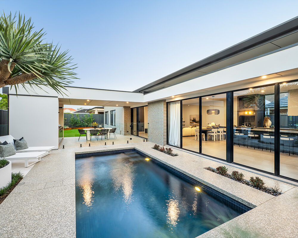 Grand Prize home pool looking back at the house into the kitchen