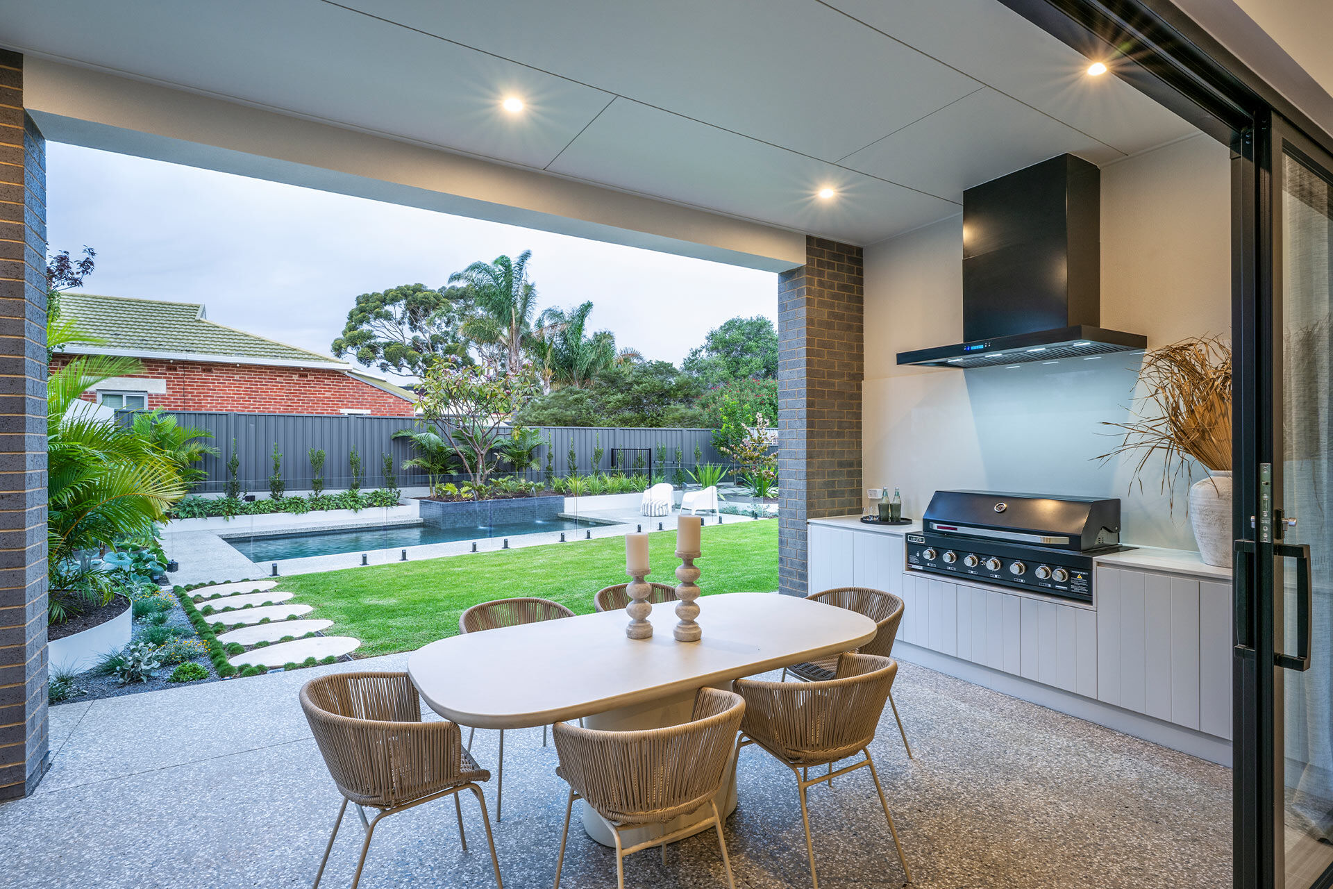 Outdoor alfresco area looking out to the lawn and pool