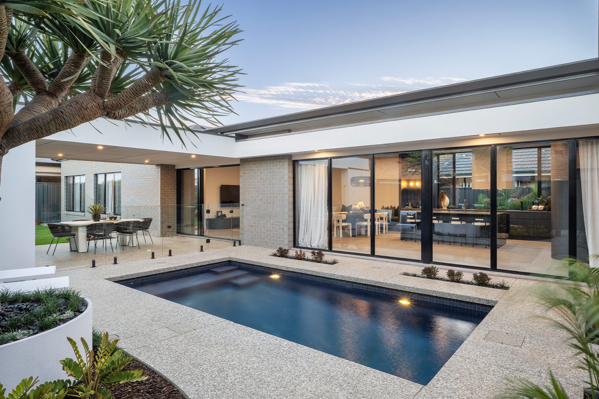 Grand Prize home pool looking back at the house into the kitchen