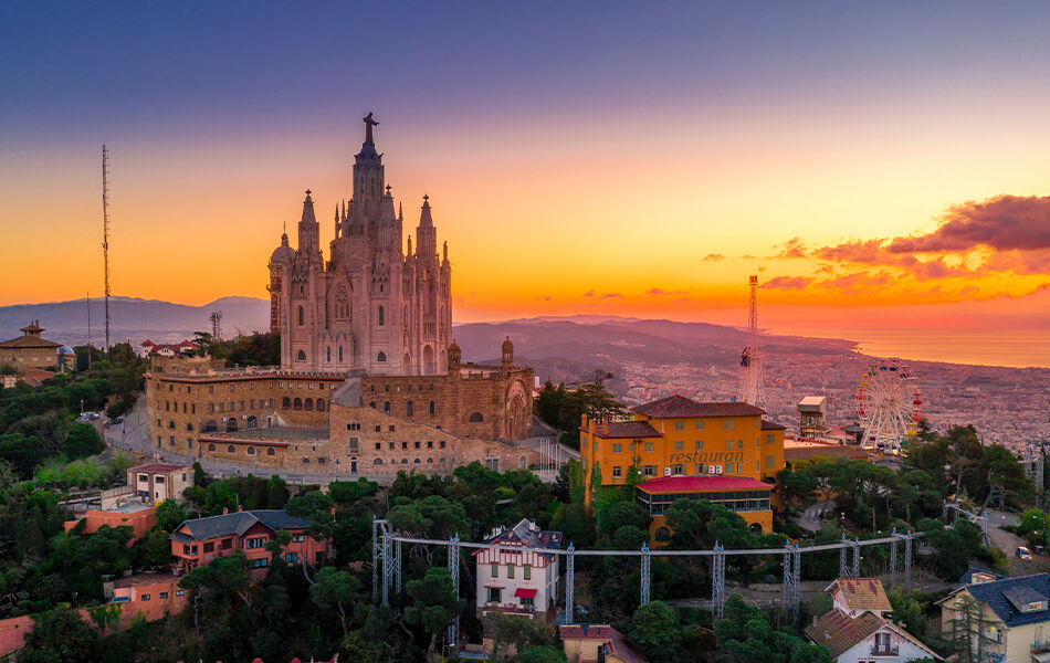 Landscape overlooking Barcelona Spain at sunset from mountain top with large cathedral